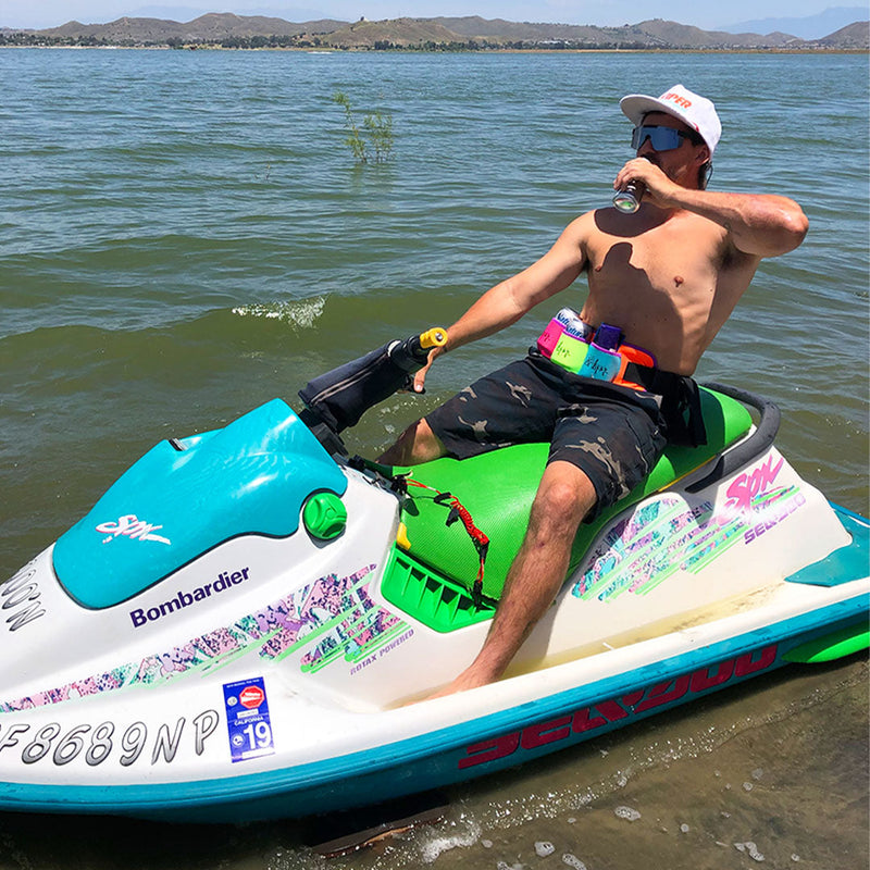  | jet_ski_lifestyle.JPG | Man on a jet ski on a lake wearing The Butt Bar Beer Belt Dayman filled with cans