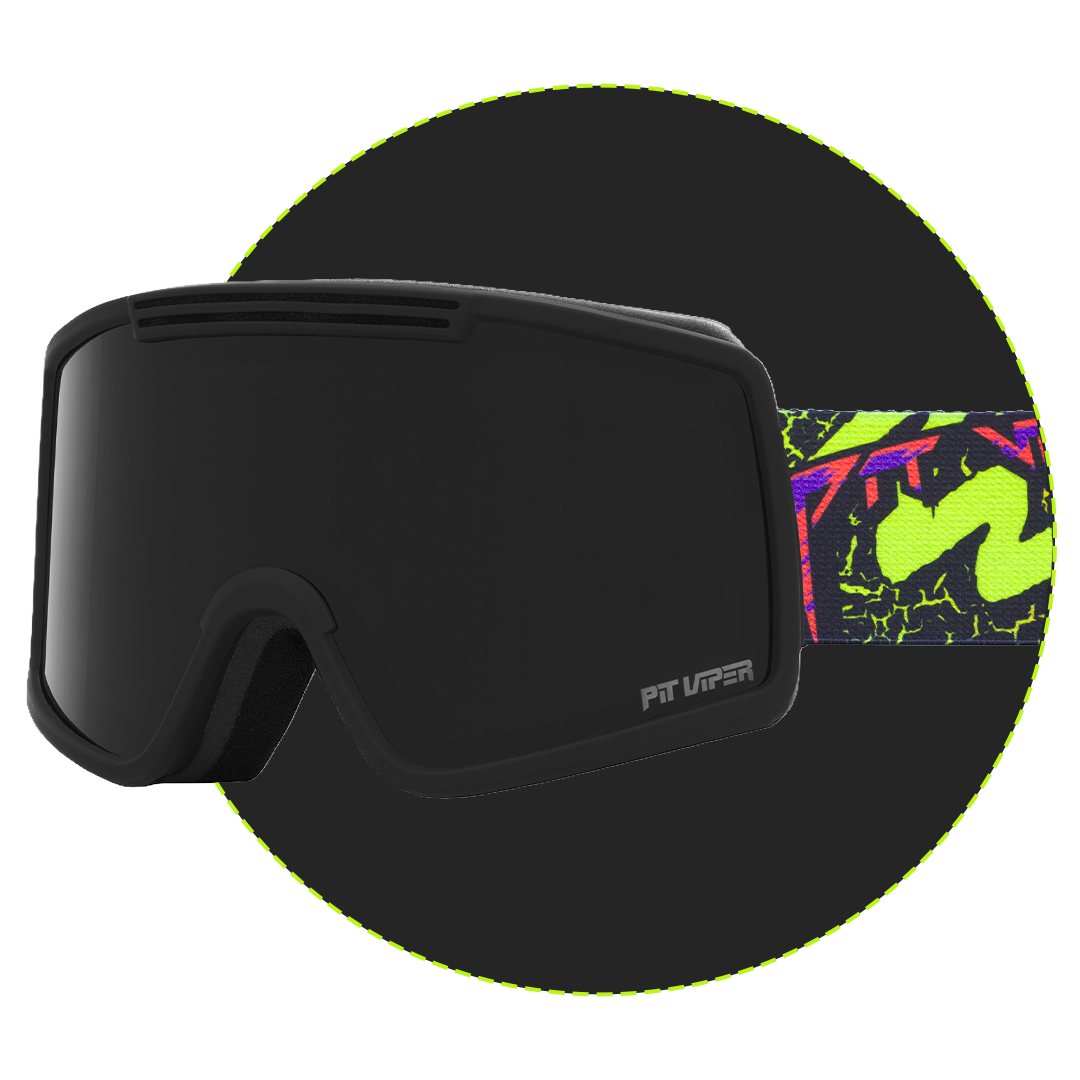 Black ski goggles with a dark tinted lens and a bright neon green, purple, and black patterned strap, shown against a black background with a neon green circular outline. The brand name 'PIT Viper' is visible on the lower right corner of the lens.