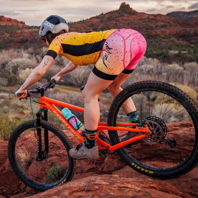  | mountain_bike_lifestyle.JPG | Woman mountain biking on red rock terrain wearing the Women's Italo Cycling Bib