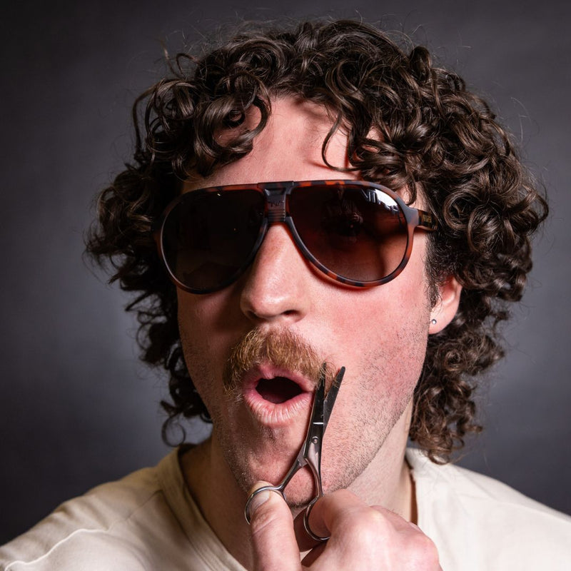 / Polarized Brown Fade | photo_of_person.JPG | Person wearing The Landlocked Jethawk with polarized Brown Fade lens