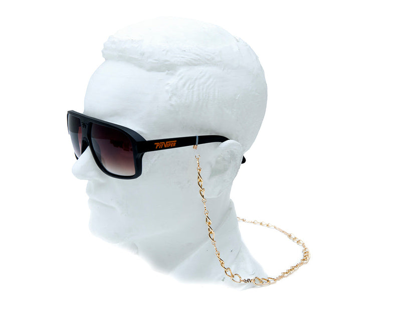 | side_view_on_mannequin.JPG | Side view of the High Roller Chain Rig gold chain sunglass retainer on a mannequin head with Pit Viper sunglasses