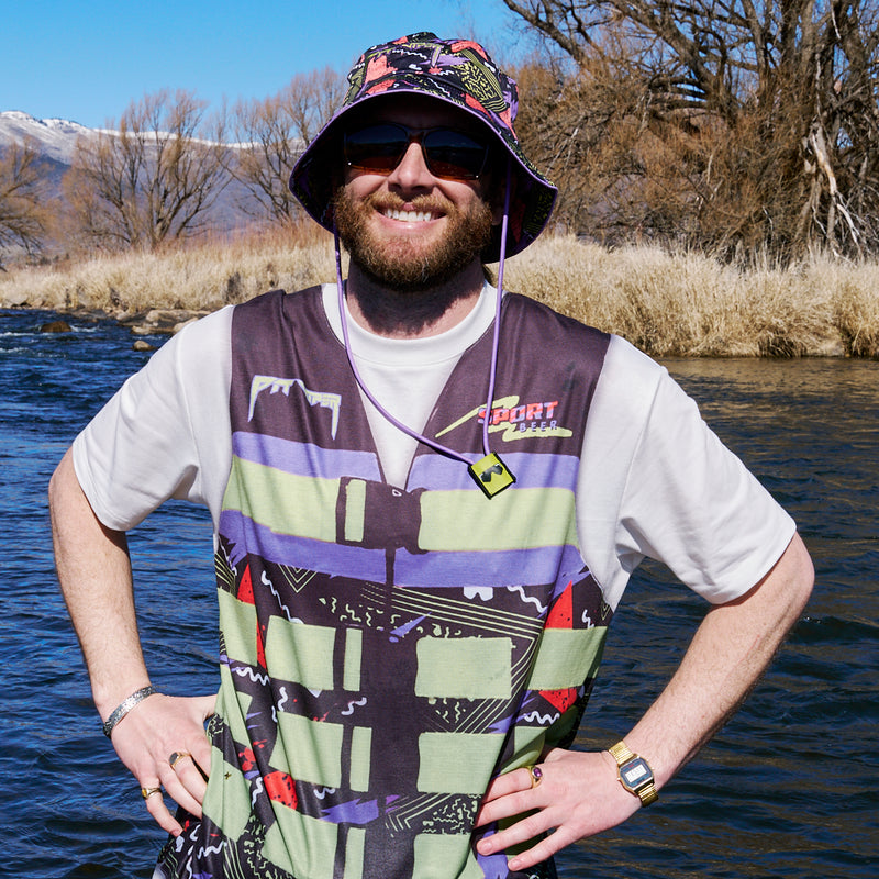  | photo_of_person.JPG | Person wearing the guy on a river wearing the Sport Beer Bucket hat from Pit Viper.