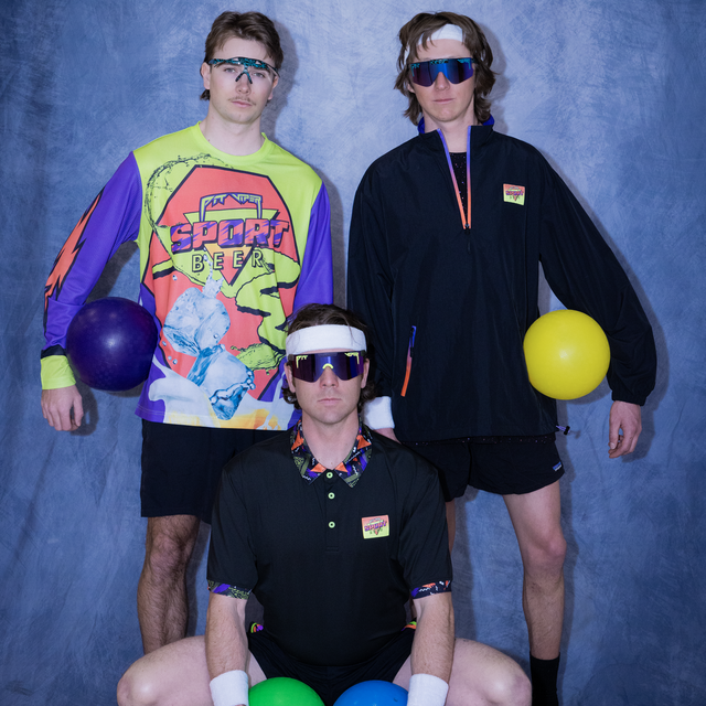 Photo of Sport Beer Athletes posing in front of a backdrop