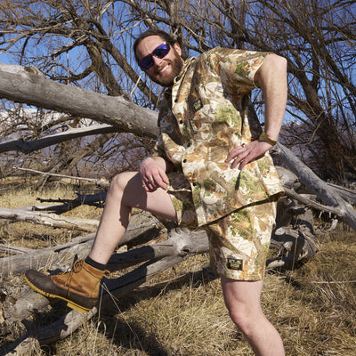  | photo_of_person_2.JPG | Smiling man wearing the actualbush sport denim shorts from Pit Viper