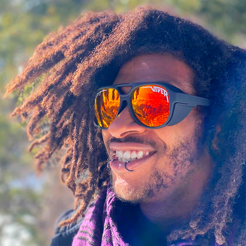 | photo_of_person.jpg | Person wearing The Exec Exciters sunglasses