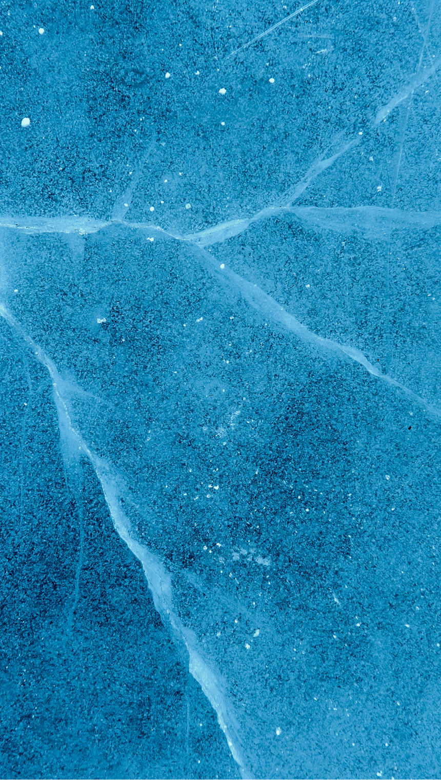 A close-up of a textured blue surface with white veining and small scattered white specks, resembling a stone or marble pattern.